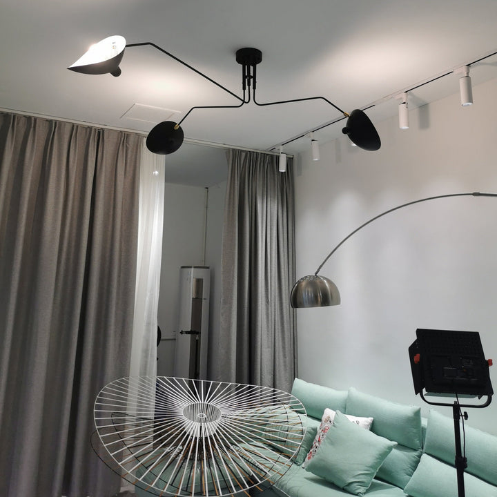 "Adjustable ceiling light with multiple arms, minimalist design, ideal for modern interiors, made of steel and aluminium."