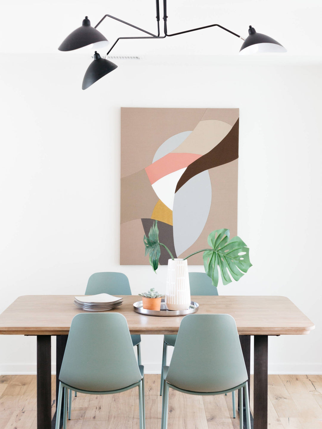"Adjustable ceiling light with multiple arms, minimalist design, ideal for modern interiors, made of steel and aluminium."