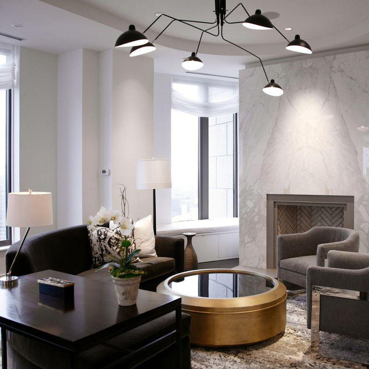 "Adjustable ceiling light with multiple arms, minimalist design, ideal for modern interiors, made of steel and aluminium."