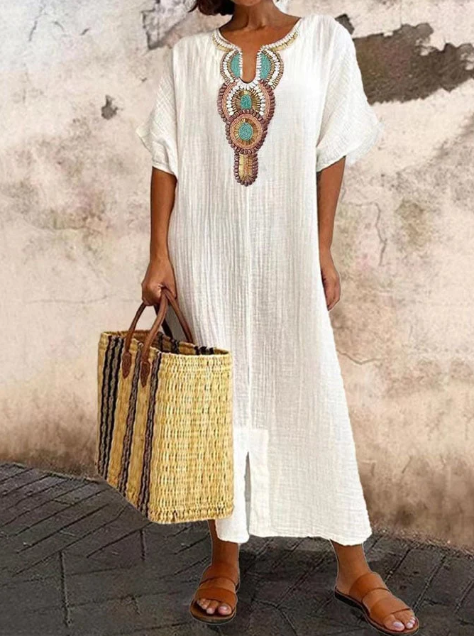 Airy cotton kaftan dress with ethnic accents, featuring a loose fit and chic bohemian style for summer wear.