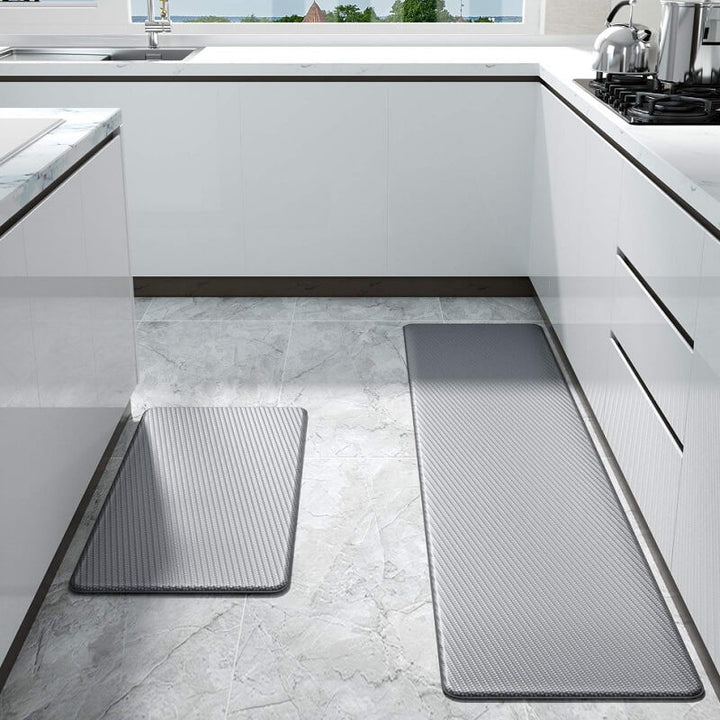 "Anti-slip waterproof kitchen rug with comfort cushioning, durable PVC, two-sided no-slip design, in grey rhombus pattern."