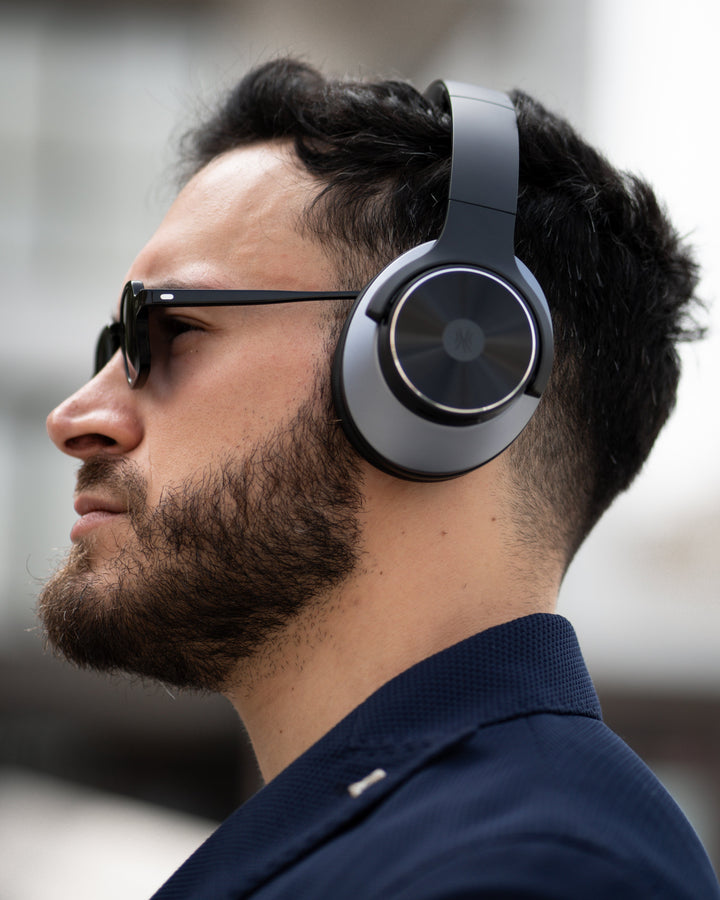 Black wireless over-ear headphones with Bluetooth and hybrid active noise cancellation, featuring memory foam earcups and USB