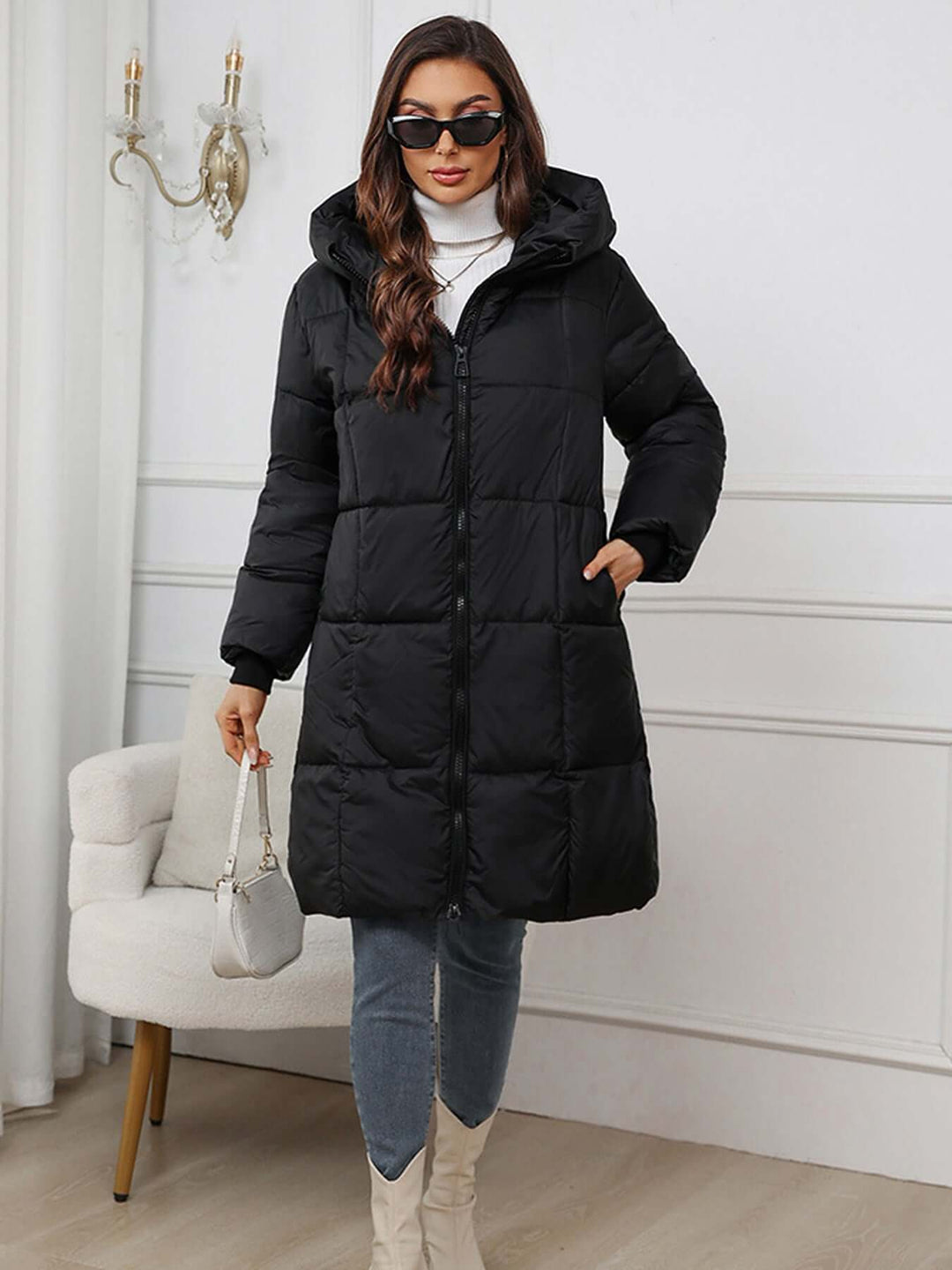 Cozy women's long hooded puffer jacket, designed for warmth in extreme cold.