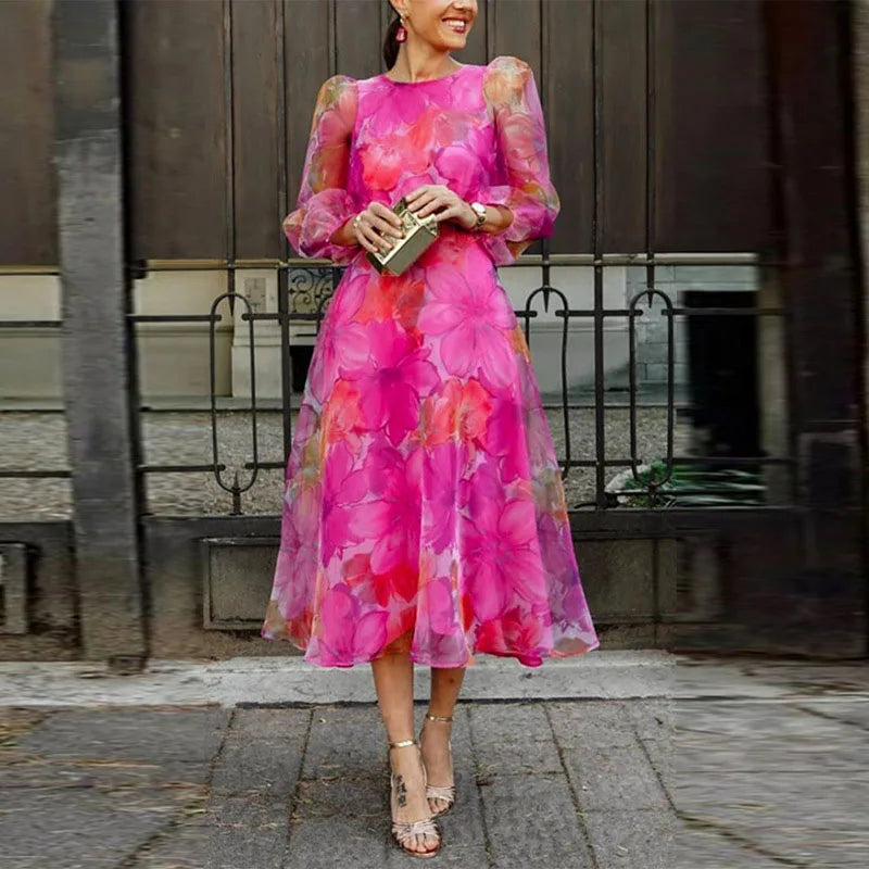 Blue and pink floral print women's dress, elegant fit, ideal for garden parties and weddings, capturing classic femininity.