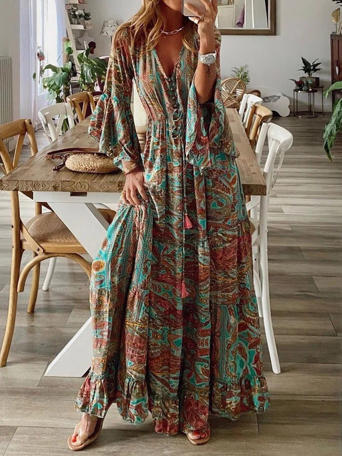 Bohemian paisley maxi dress with flared sleeves, vibrant print, flowy design, captures chic style for women's summer wear.