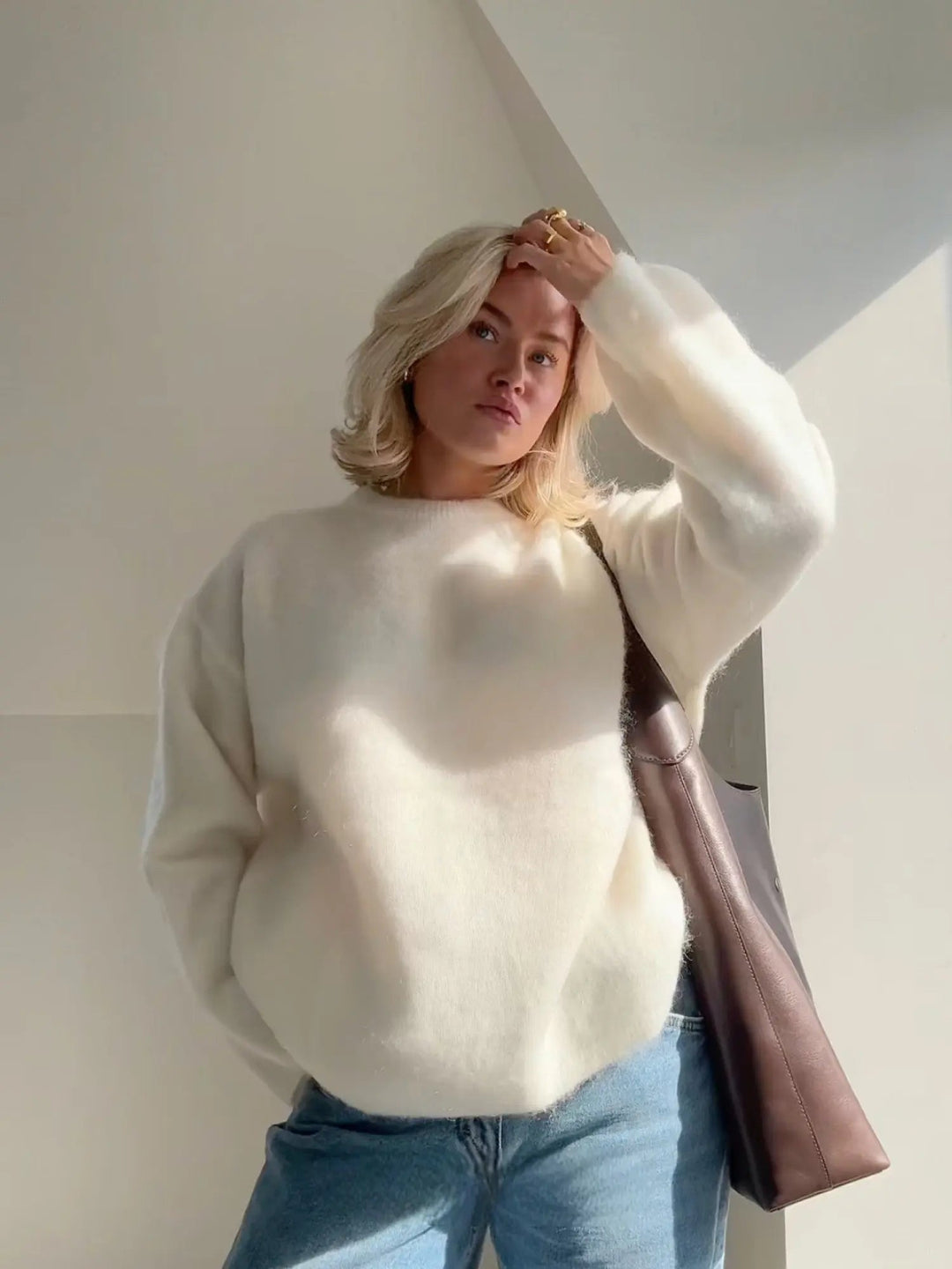 Versatile grey women's elegant sweater, a relaxed fit pullover for sophisticated comfort.