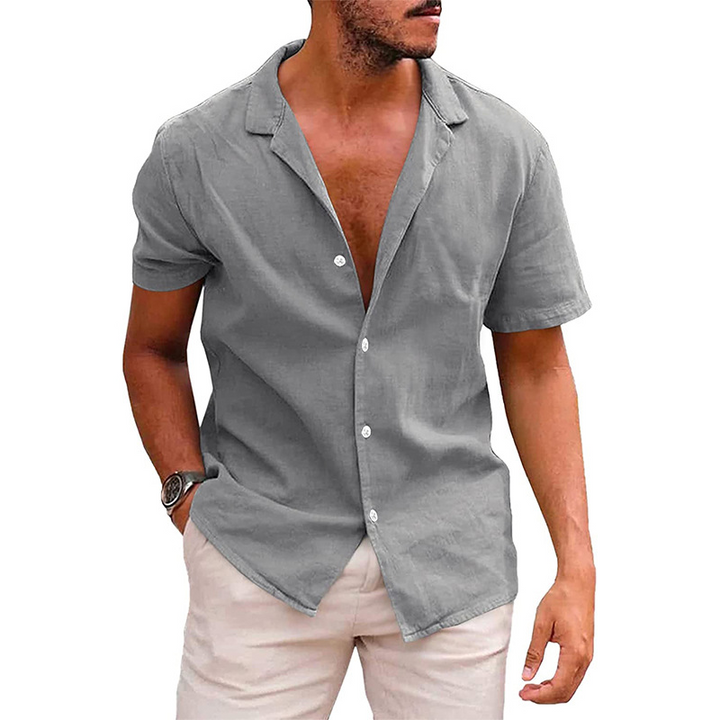 "Casual men's short-sleeve button-down shirt with a relaxed fit and open collar in light blue, perfect for summer comfort."
