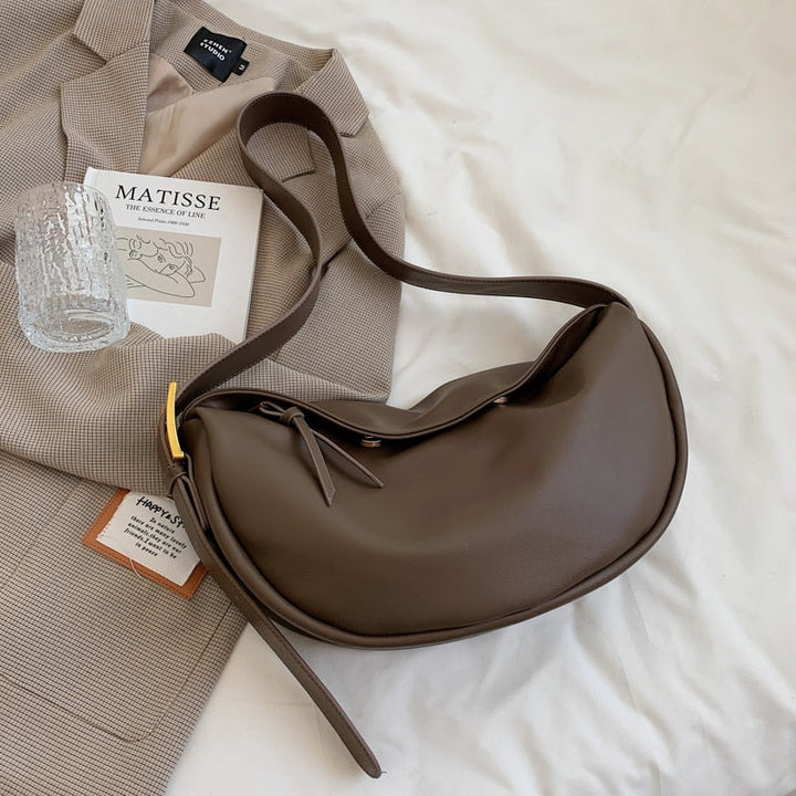 Stylish women's crossbody shoulder bag. Features an adjustable strap, perfect as a versatile everyday chic accessory.