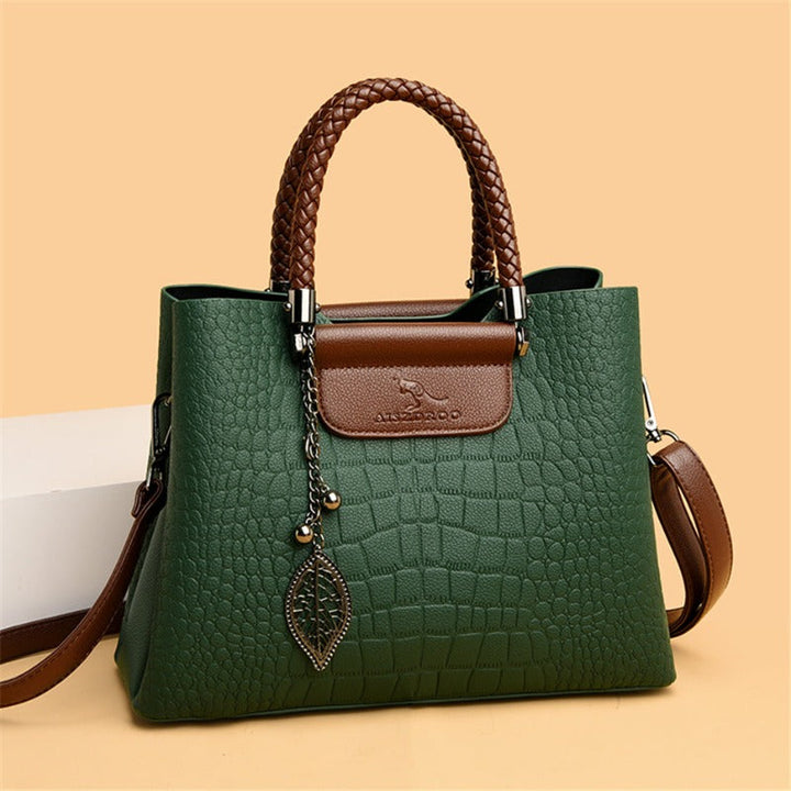 Elegant green women's shoulder bag. Durable and fashionable everyday tote for a chic accessory.