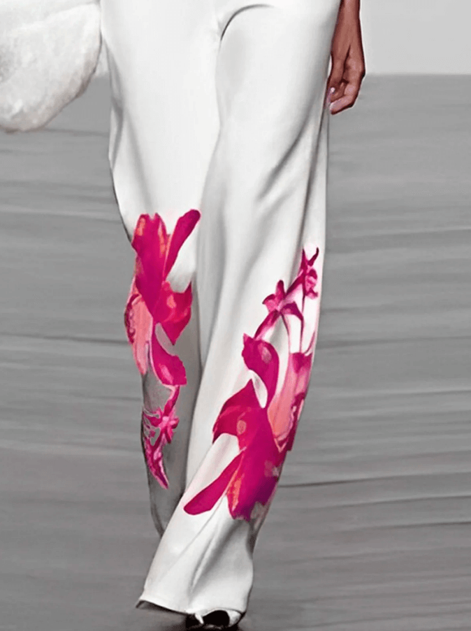 Comfortable women's floral two-piece set: elegant turtleneck top and flowing wide-leg pants. Casual summer style.