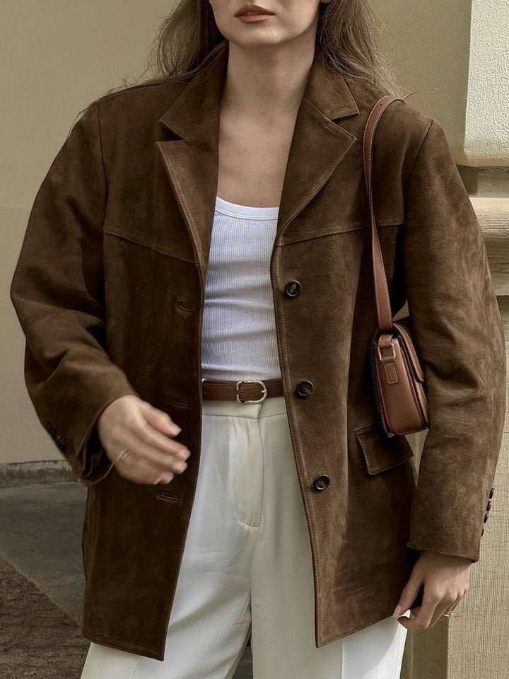 Chic women's oversized suede jacket with stylish button-front. Versatile fashion outerwear for work or weekend.
