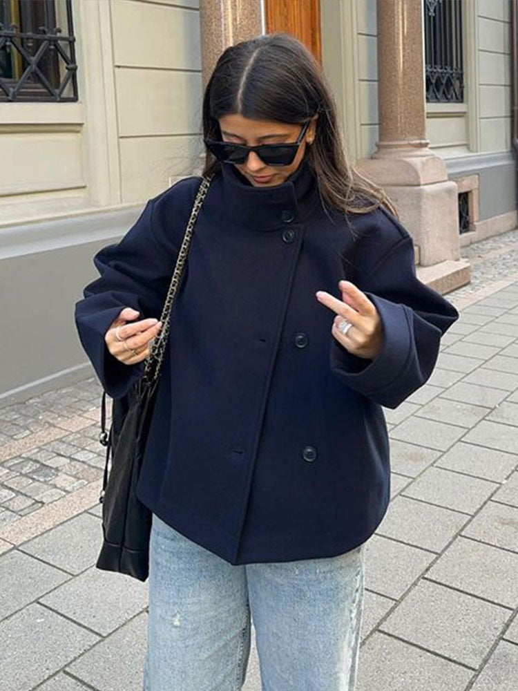 Chic women's short double-breasted jacket in a versatile style, perfect for fall & winter fashion. Elegant outerwear.