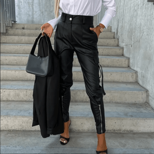Chic women's slim fit PU leather cargo pants in black, featuring modern style & utility pockets.