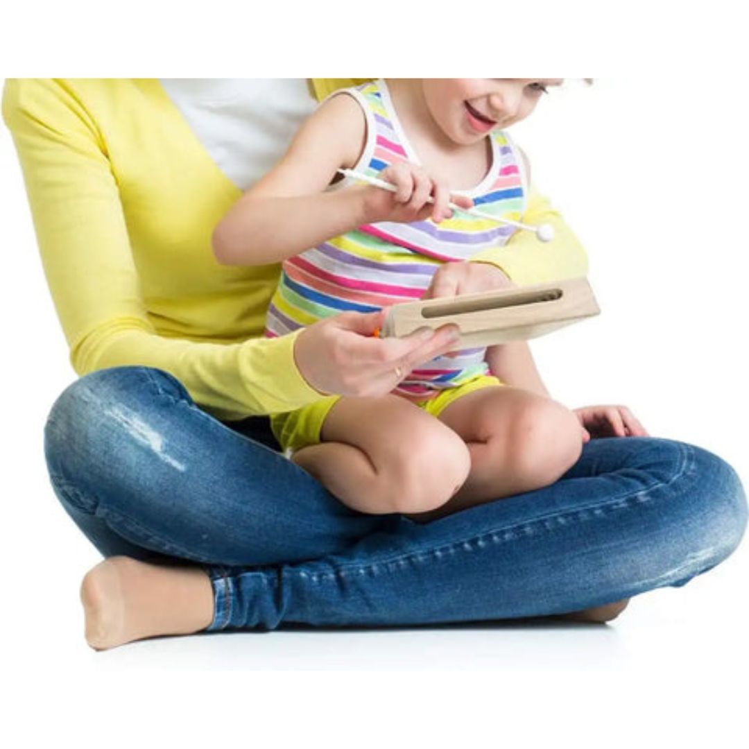"Children's wooden music kit with hand drum, maracas, tambourine, fostering creativity and motor skills in young musicians."