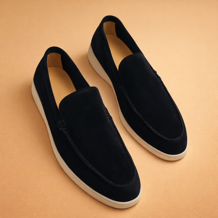Elegant black penny loafers for men, ideal for office or casual smart look. Comfortable slip-on design.