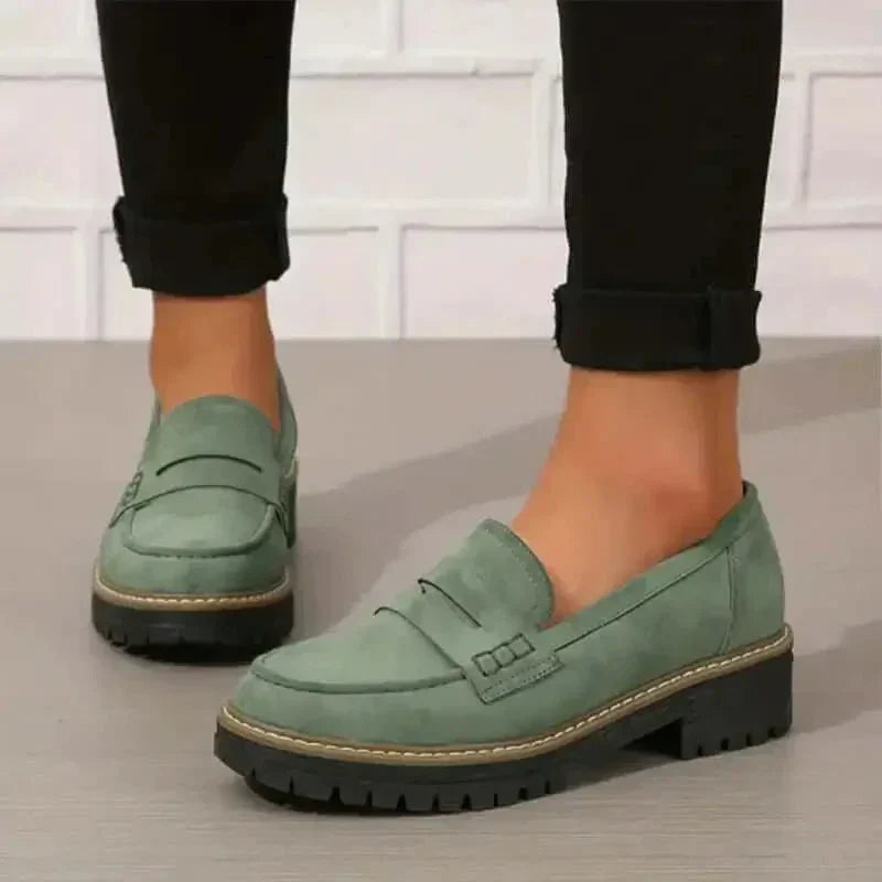Fashionable women's chunky slip-on loafers, offering comfort and style for versatile daily wear.