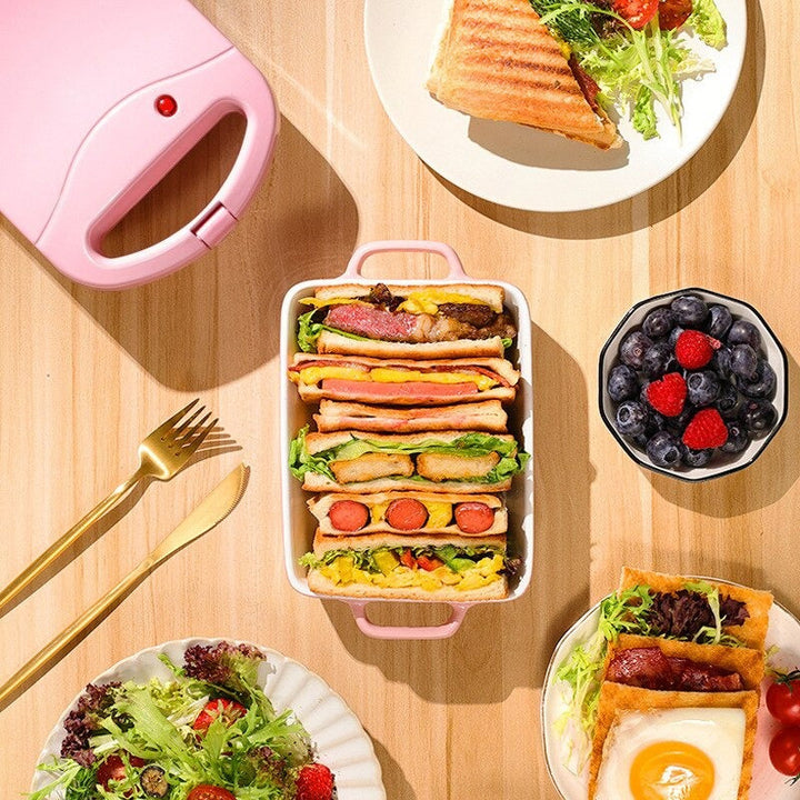 Compact 2-in-1 non-stick sandwich maker & toaster, sleek design, cooks 2 slices, even heating, perfect for small kitchens.