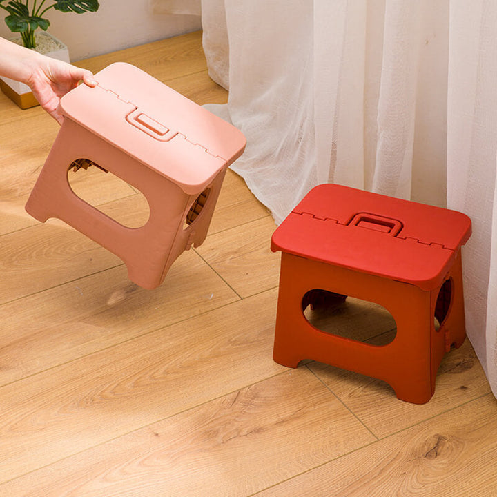 "Compact folding step stool with handle; durable plastic, various colors; perfect for kids and adults in any space."