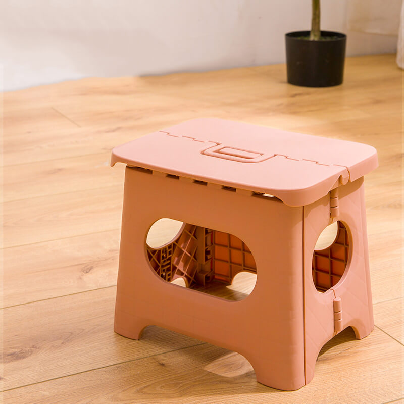"Compact folding step stool with handle; durable plastic, various colors; perfect for kids and adults in any space."