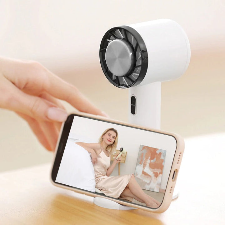 "Compact portable handheld air cooling fan, minimalist design with powerful cooling, perfect for travel and home use."