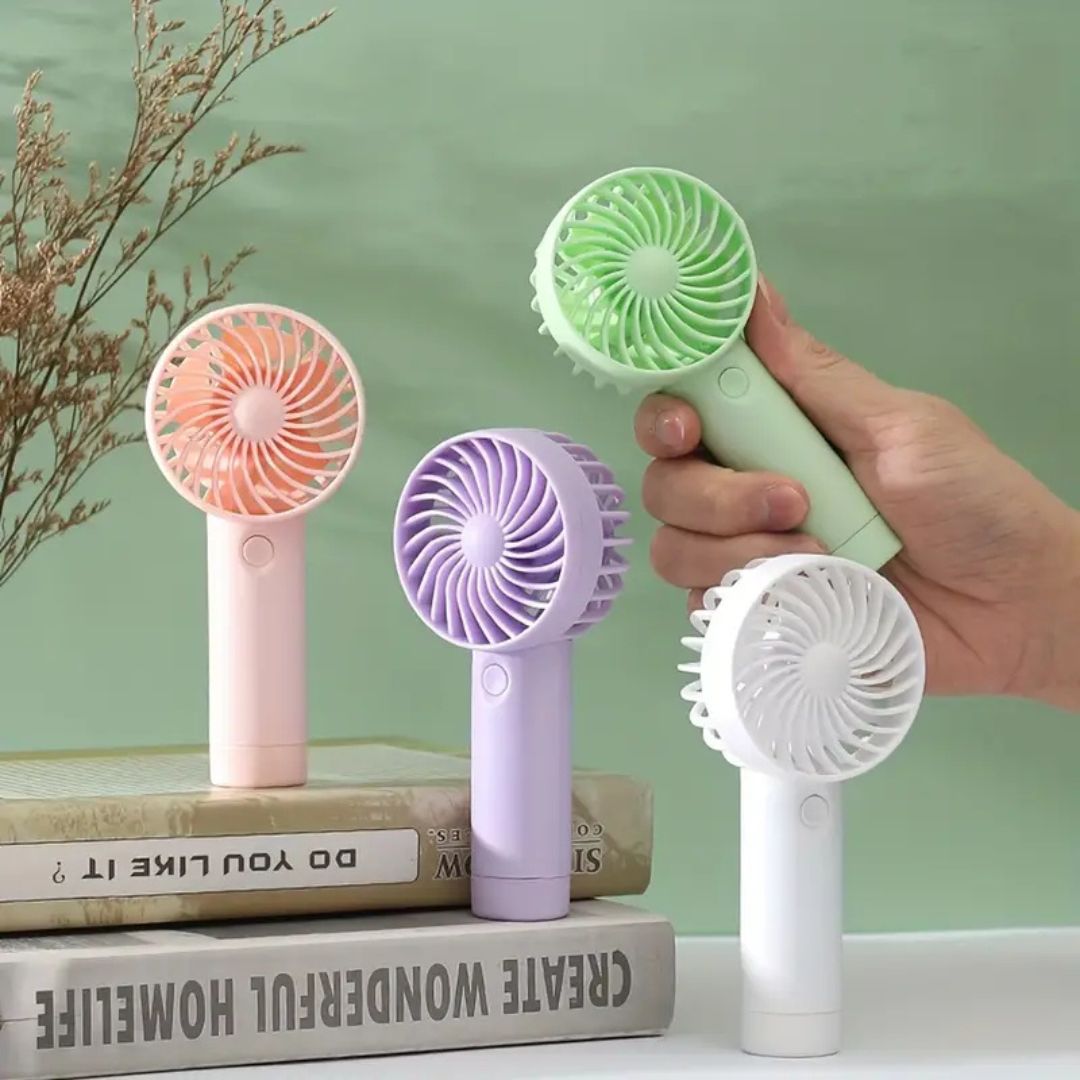 "Compact portable mini fan, sleek design in white, pocket-sized cooler for travel or office, beauty wellbeing essential."