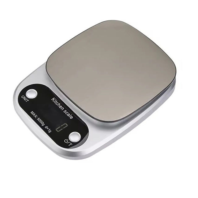 "Compact stainless steel kitchen scale with sleek design for precise 0.1g measurements, ideal for culinary accuracy."