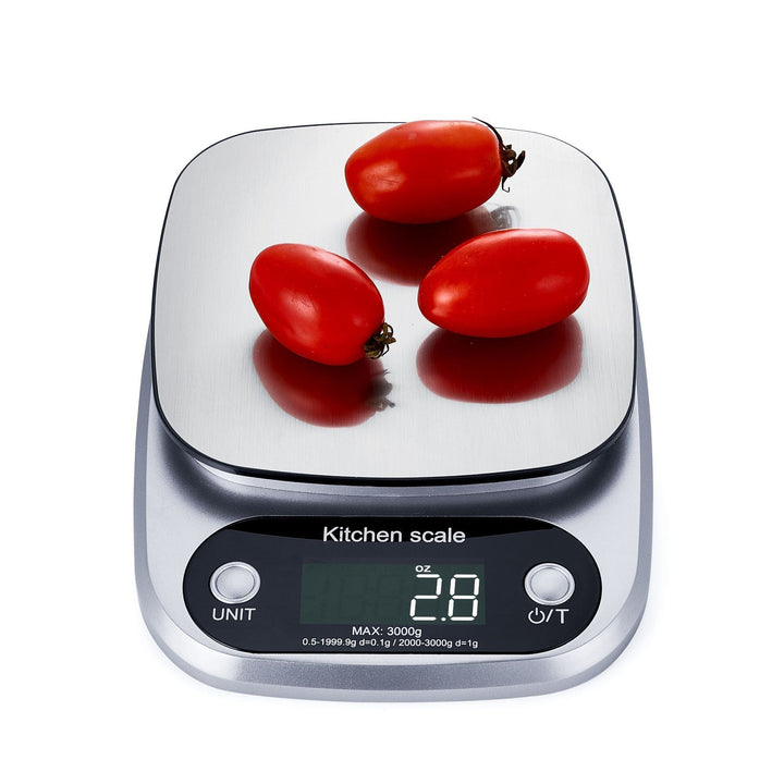 "Compact stainless steel kitchen scale with sleek design for precise 0.1g measurements, ideal for culinary accuracy."