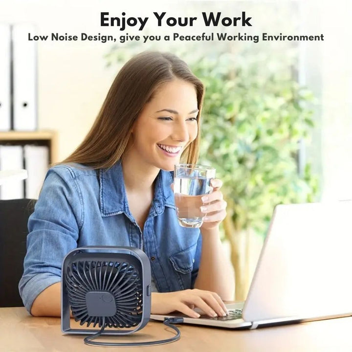 "Compact USB desk fan with 360° rotation, mini size, black frame, adjustable 3-speed settings, ideal for workspace."