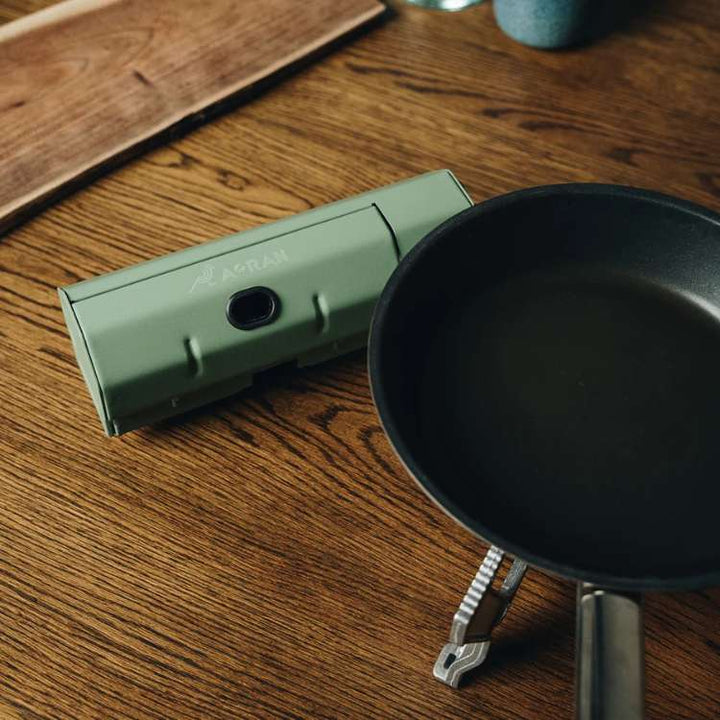 Compact windproof camping gas stove with foldable design, perfect for outdoor use; fits easily into backpacks for adventure.