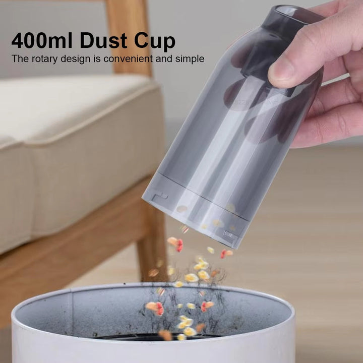 Compact wireless car vacuum cleaner with handle and nozzle for powerful, portable cleaning; sleek design, perfect for vehicle
