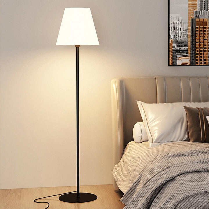 "Contemporary metal and acrylic floor-standing lamp with sleek lines, modern flair, perfect for home decor lighting."