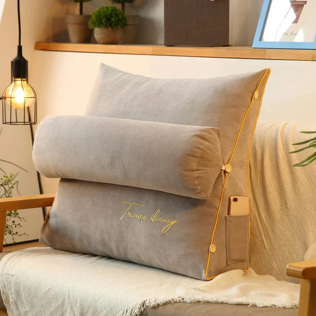 Contoured wedge pillow with ergonomic design, offering back support and a soft fabric cover for comfort and pressure relief.