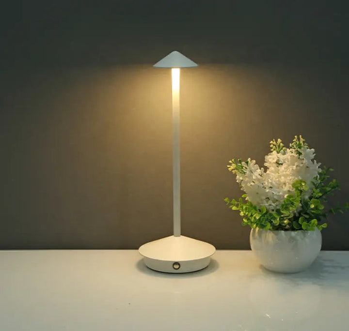 "Cordless rechargeable table lamp, sleek pine-like design, touch control, USB-powered, waterproof, dimmable LED lighting."