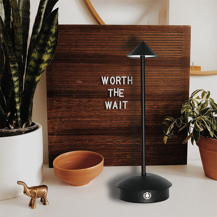 "Cordless rechargeable table lamp, sleek pine-like design, touch control, USB-powered, waterproof, dimmable LED lighting."