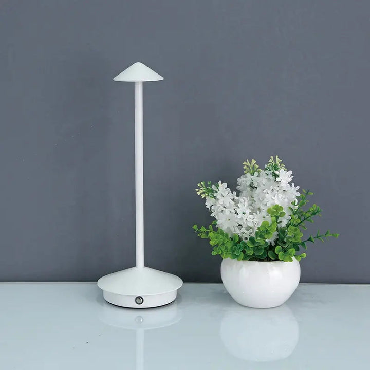 "Cordless rechargeable table lamp, sleek pine-like design, touch control, USB-powered, waterproof, dimmable LED lighting."