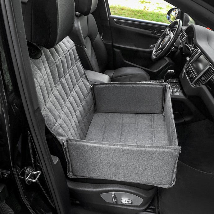 Cozy padded dog car seat basket for safe travel, features secure straps, plush padding, stylish design, ideal for pets.