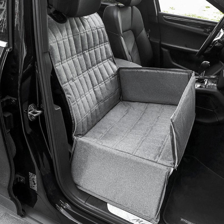 Cozy padded dog car seat basket for safe travel, features secure straps, plush padding, stylish design, ideal for pets.