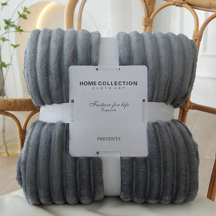 Cozy plush wide-stripe fleece throw blanket in a neutral tone, perfect for living room comfort & warmth.