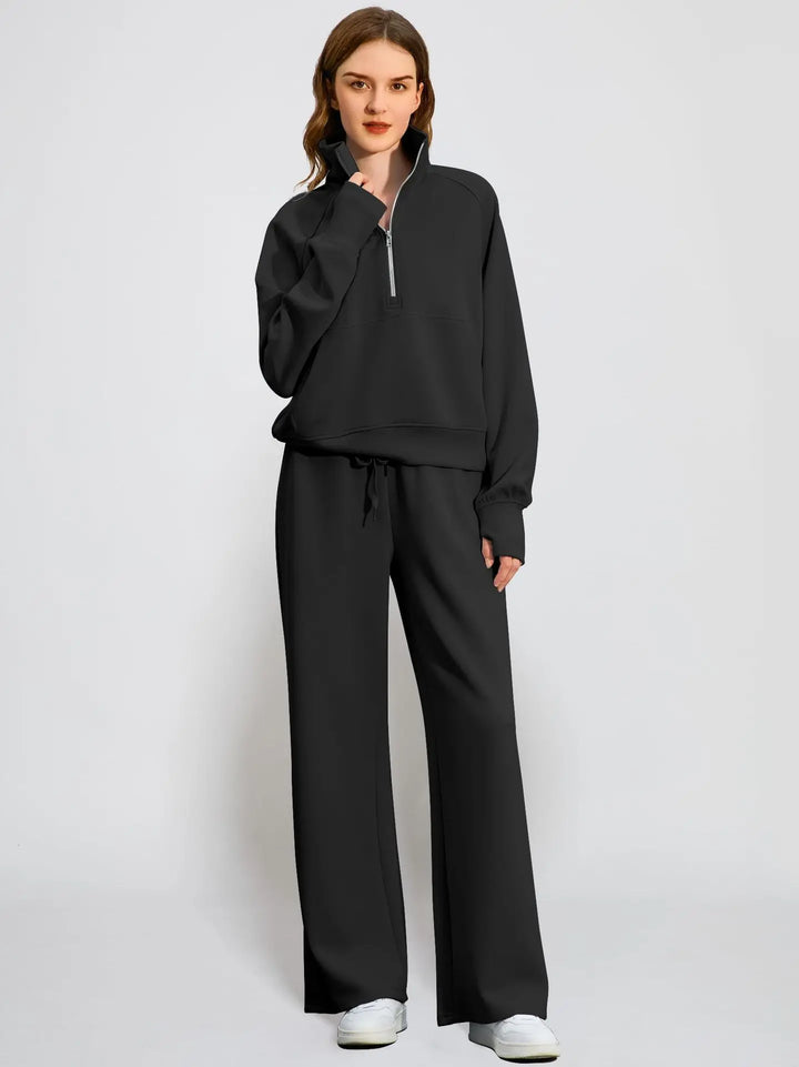 Women's two-piece loungewear: half-zip top & wide-leg pants. Soft, cozy, and perfect for relaxation.