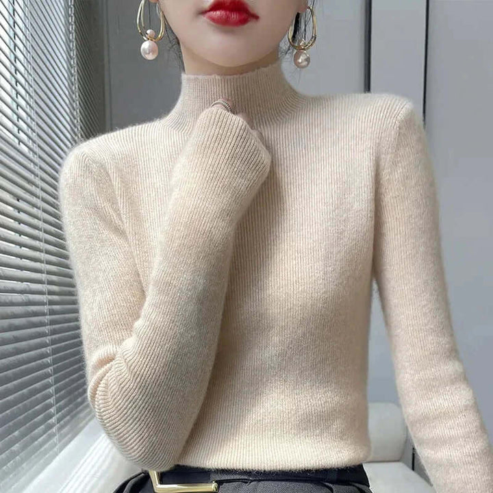 Warm, soft acrylic blend women's knitted half turtleneck sweater for chilly fall evenings.