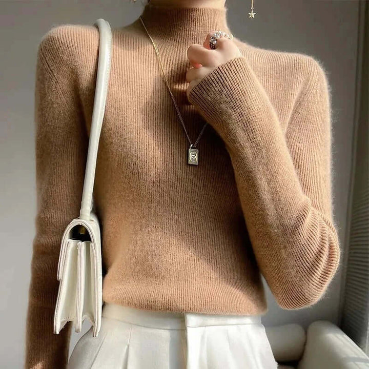 Long sleeve women's knitted pullover with a cozy half turtleneck, ideal for layering.