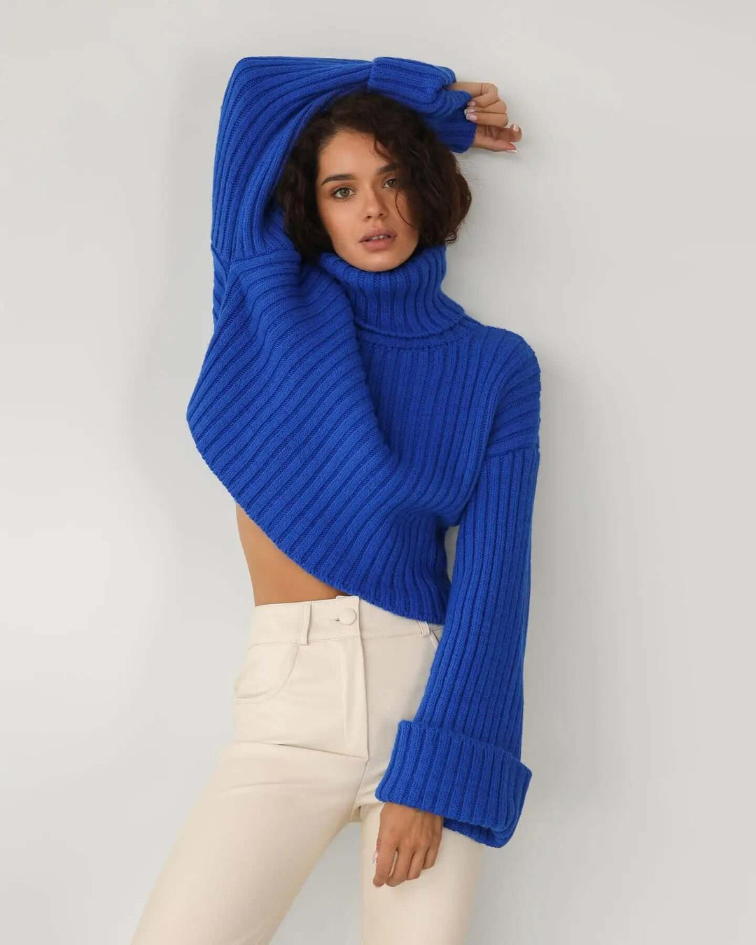 Warm women's knitted pullover sweater. Cozy long sleeve design for stylish winter and fall comfort.