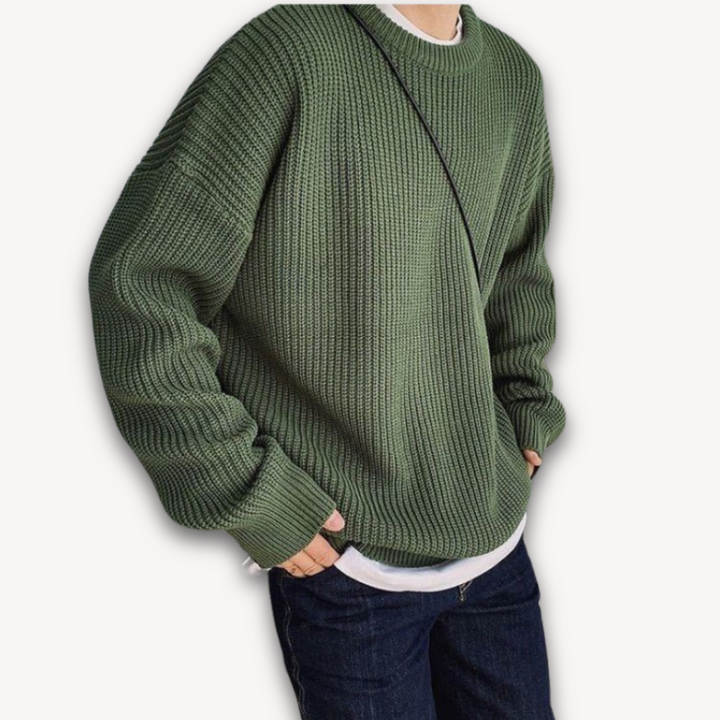 Dark green men's oversized knit sweater, soft acrylic, ribbed texture, cozy winter wear, casual elegance, warm menswear.