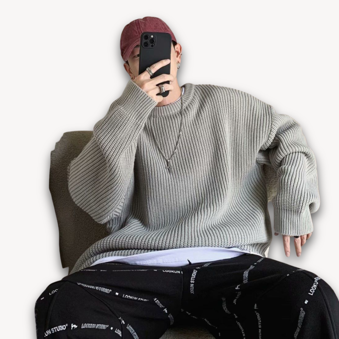 Dark green men's oversized knit sweater, soft acrylic, ribbed texture, cozy winter wear, casual elegance, warm menswear.