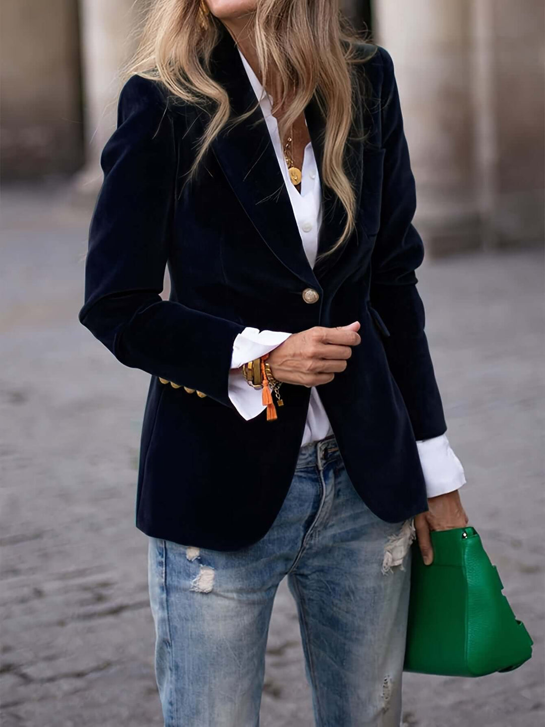 Stylish dark green velvet blazer, women's formal wear with elegant golden button detailing.