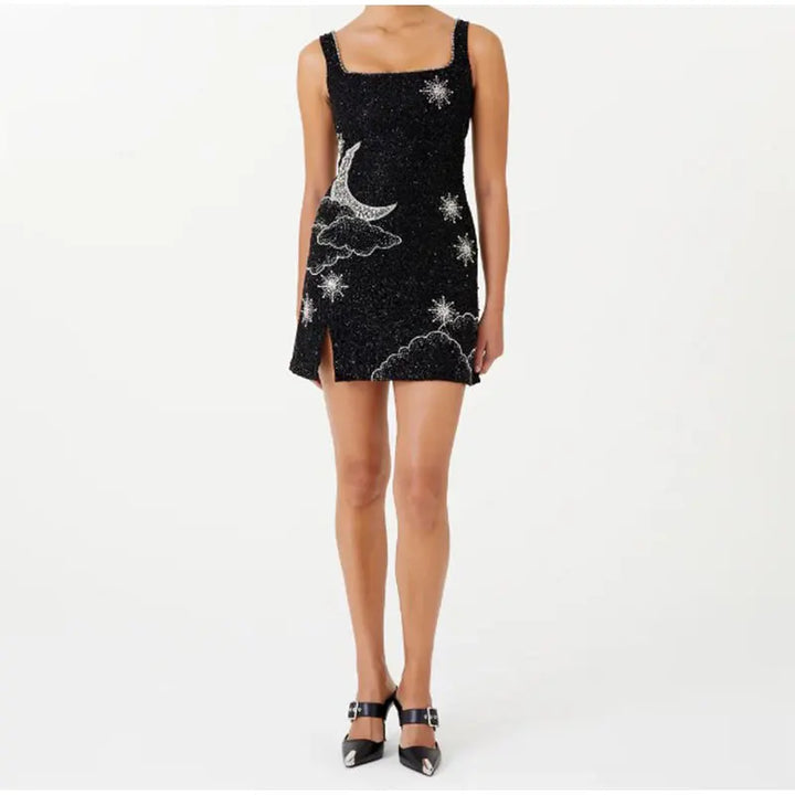 Women's glamorous black sequin mini dress, ideal cocktail attire for parties & special occasions. Shimmering evening wear.
