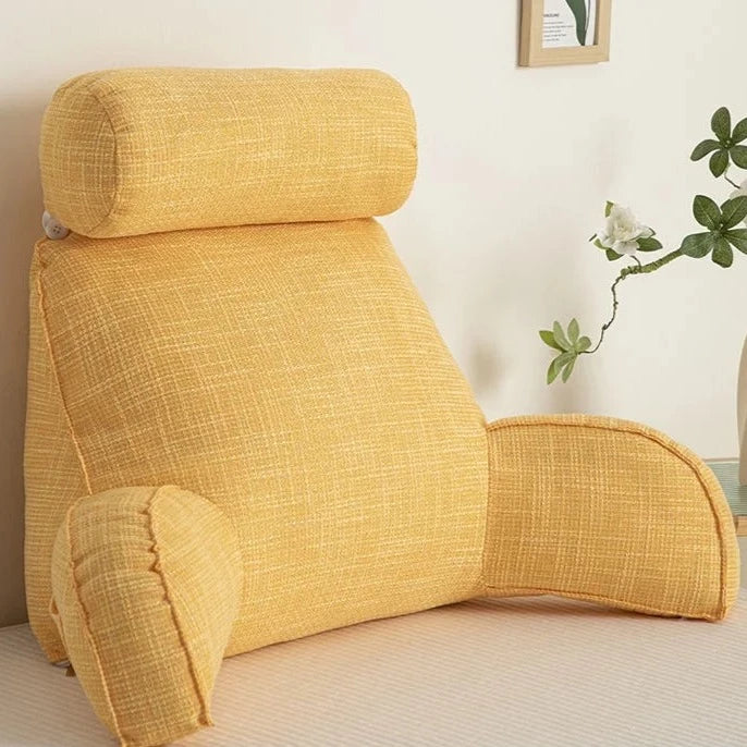 "Deluxe backrest pillow with arms and headrest in cream, featuring a soft-touch finish and side pocket for added convenience.