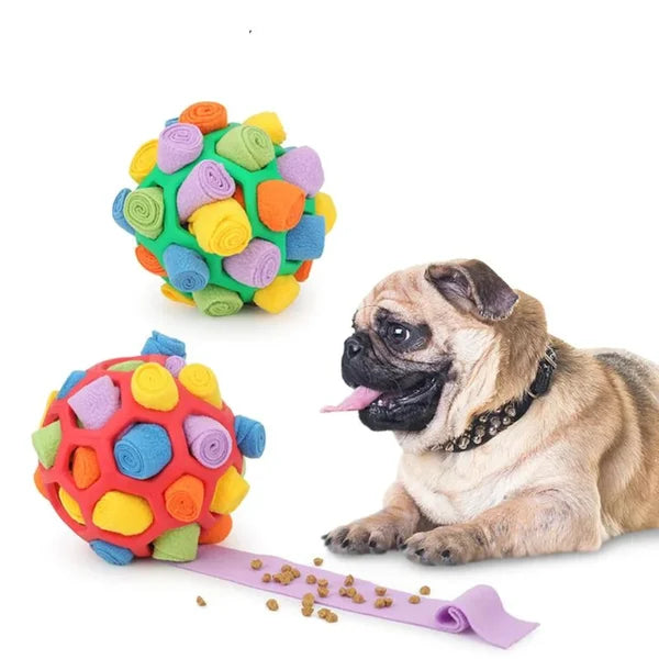 Dog's interactive snuffle treat ball in blue, green, and red, made of plush fleece and durable rubber for engaging playtime.