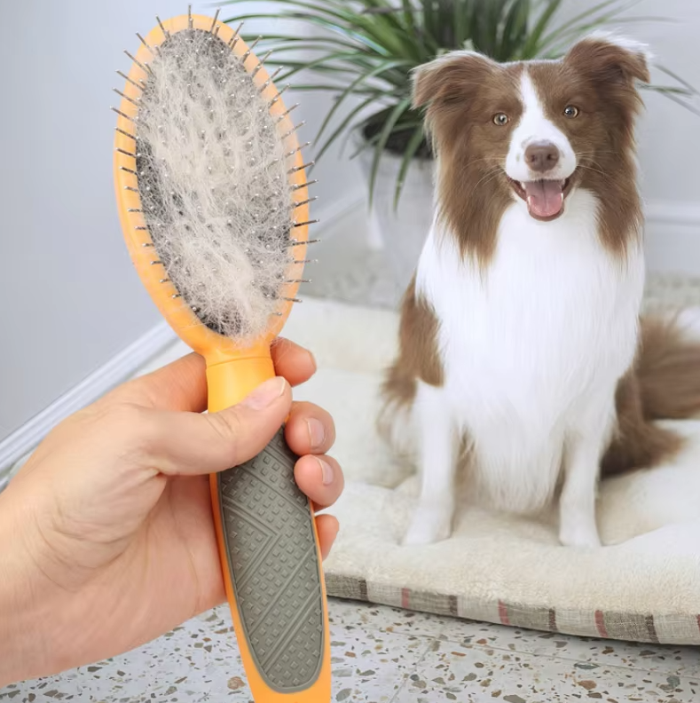 Double-sided pet brush with soft bristles and metal pins for grooming dogs and cats, ensuring a shiny, healthy coat.