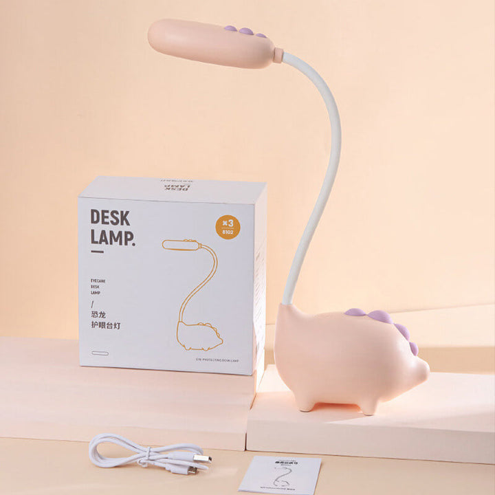 Eco-friendly T-Rex LED desk light for kids; whimsical dino shape, adjustable neck, soft eye-caring light; available in yellow